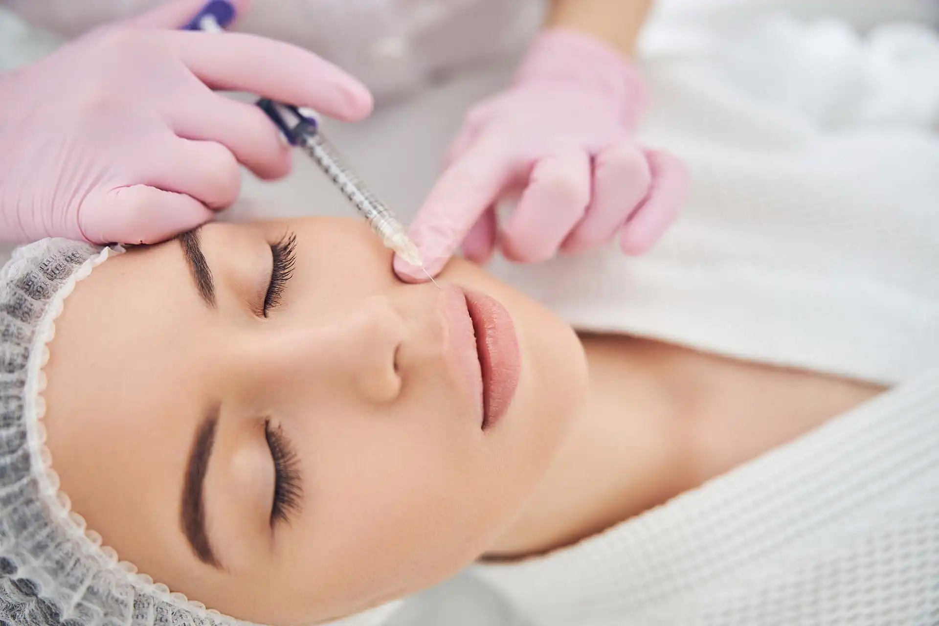 Dermatologist performing Dermotoxin Botox treatment in Gangnam Korea to smooth forehead, frown lines, and crow’s feet